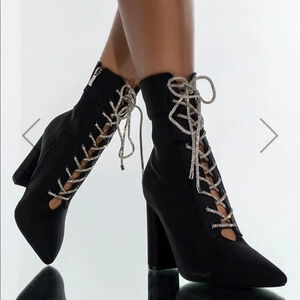 Elegant Black Heeled Boots with Silver Accents
